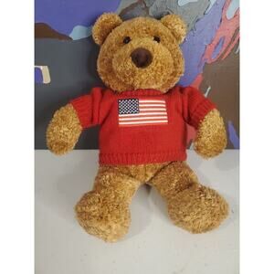 Saks Fifth Avenue Department Store plush bear wearing red American flag sweater